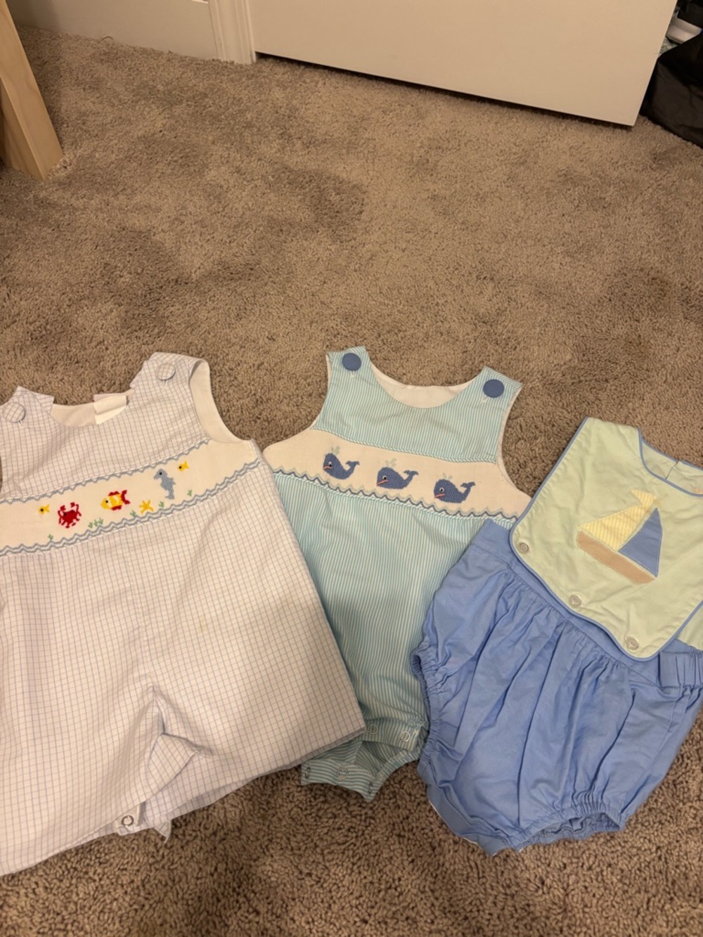 Set of three stichy fish ect baby outfits